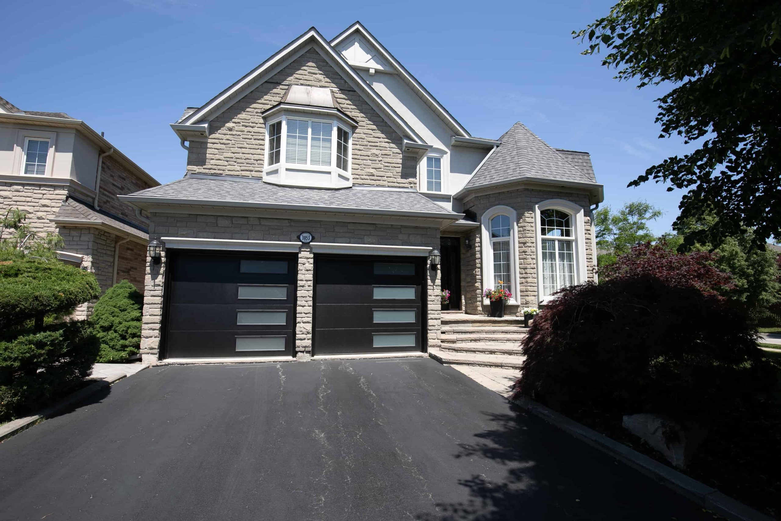 Black garage door with windows